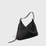 JONES + CO Rider M Elche black leather bag with a unique hand-braided strap and architectural silhouette.