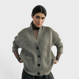 SISA Felted Alpaca Cardigan in Moss, front view with hands in the patch pockets