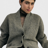 SISA Felted Alpaca Cardigan in Moss, front view buttoned, seated