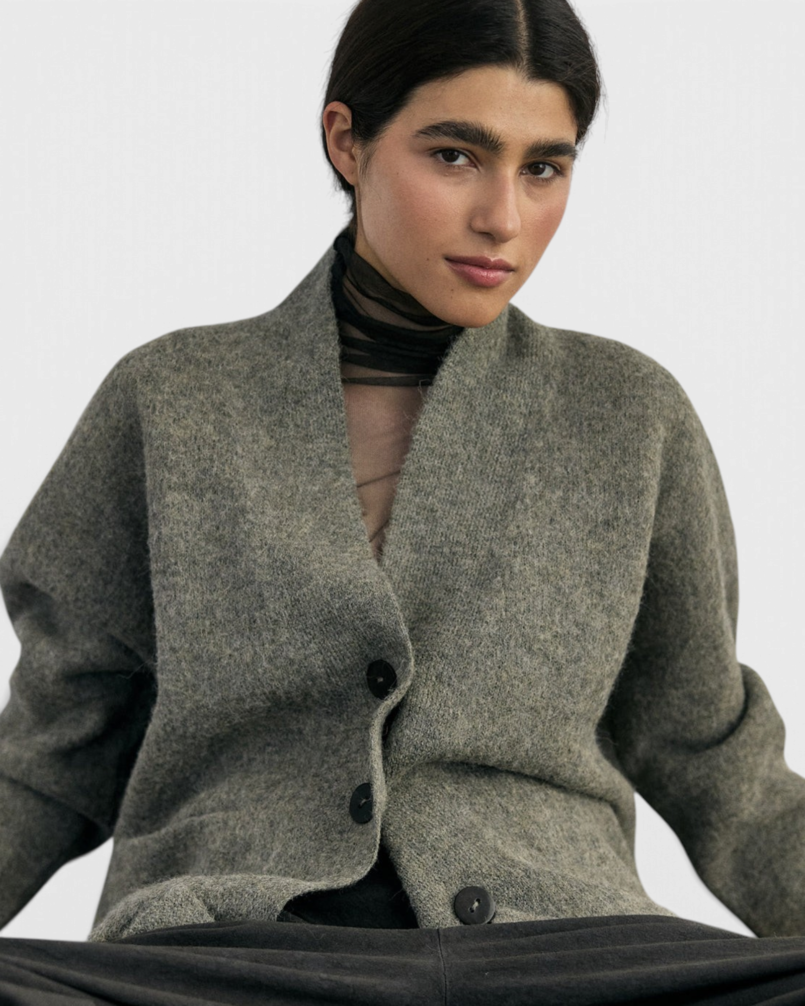 SISA Felted Alpaca Cardigan in Moss, front view buttoned, seated