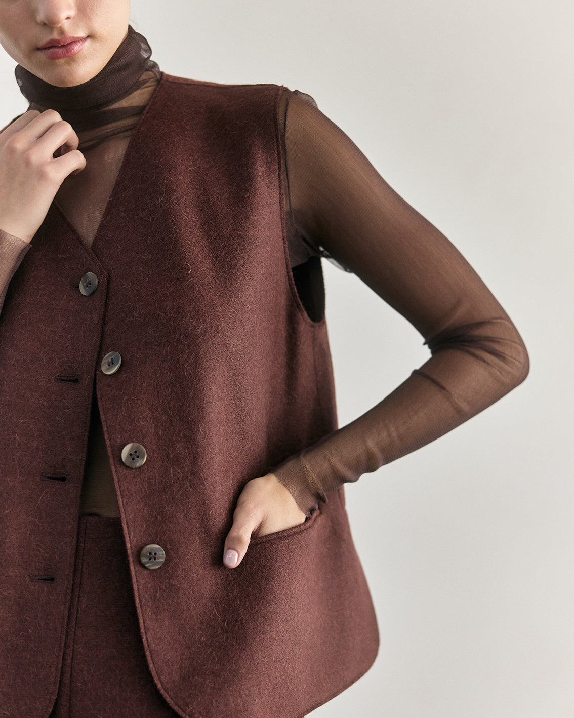 SISA Silk Tulle Beatle in Eggplant, layered under a felted vest, front detail
