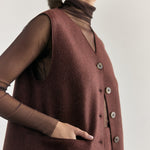 SISA Silk Tulle Beatle in Eggplant, layered under a felted vest, side detail of the sleeve