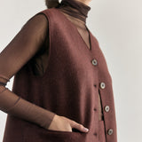 SISA Silk Tulle Beatle in Eggplant, layered under a felted vest, side detail of the sleeve