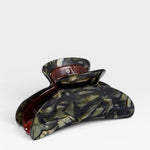 Tortoiseshell patterned hair clip on a white background