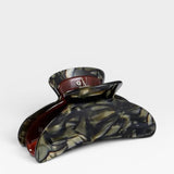 Tortoiseshell patterned hair clip on a white background