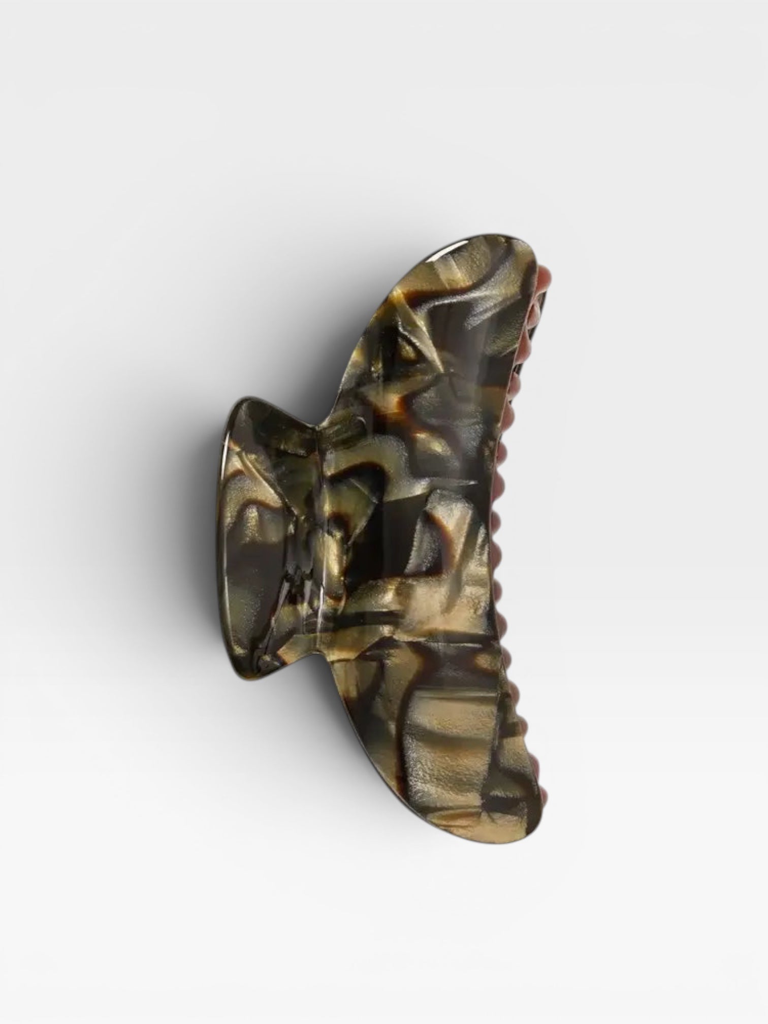 Tortoiseshell patterned hair clip on a white background