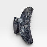 Black marble wall sculpture on a white background