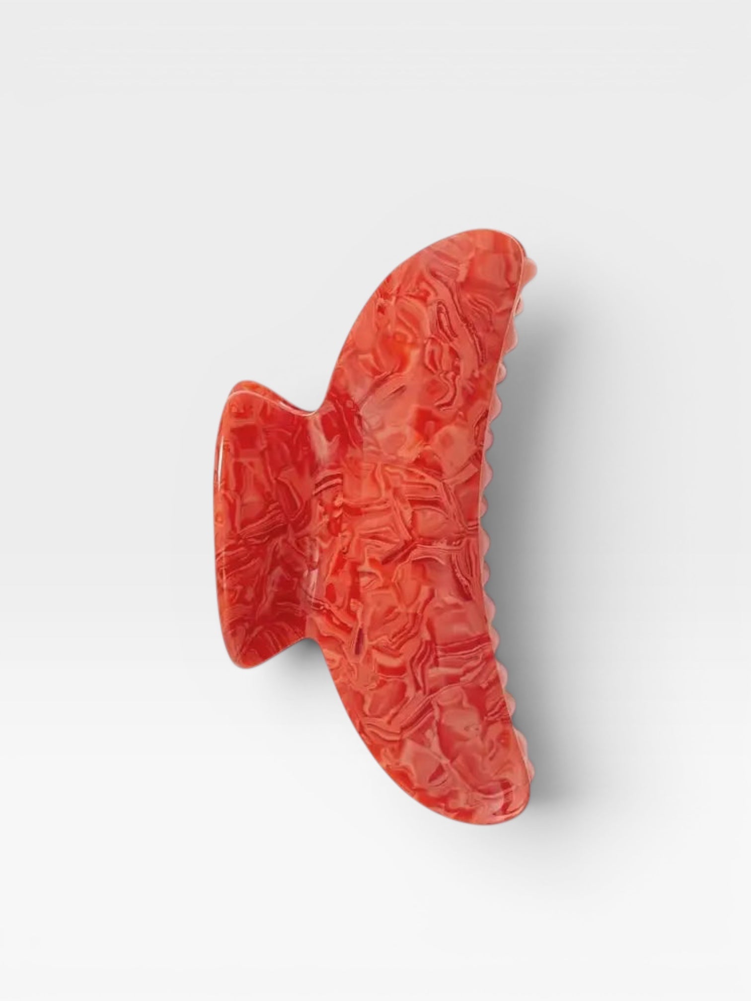 Red clip on a white background