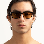 Comanche Sunglasses - Chelonian straight on view on male model 