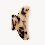Claw clip with a tortoiseshell pattern on a white background