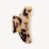 Claw clip with a tortoiseshell pattern on a white background