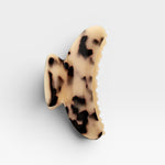 Claw clip with a tortoiseshell pattern on a white background