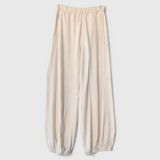 JONES + CO natural balloon pants with high elastic waist, side pockets, and gathered elastic leg openings.