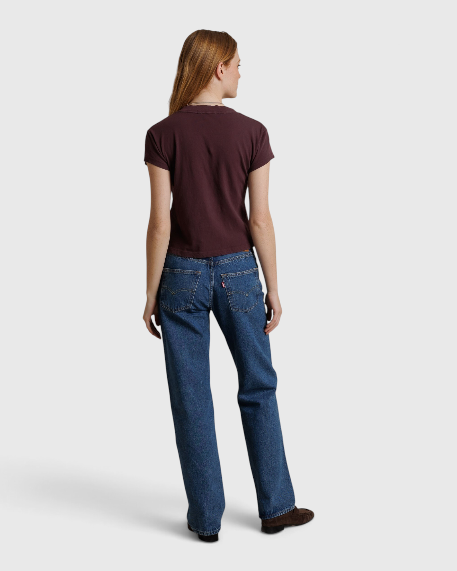 JONES + CO Alanis V Neck tee in cherry lacquer recycled cotton worn with blue jeans, back view