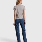 JONES + CO Alanis V Neck tee in cloud gray recycled cotton, shown from the back on a model with blue jeans.