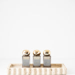 512 Tray - Travertine with perfume on it 