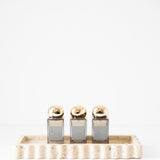512 Tray - Travertine with perfume on it 