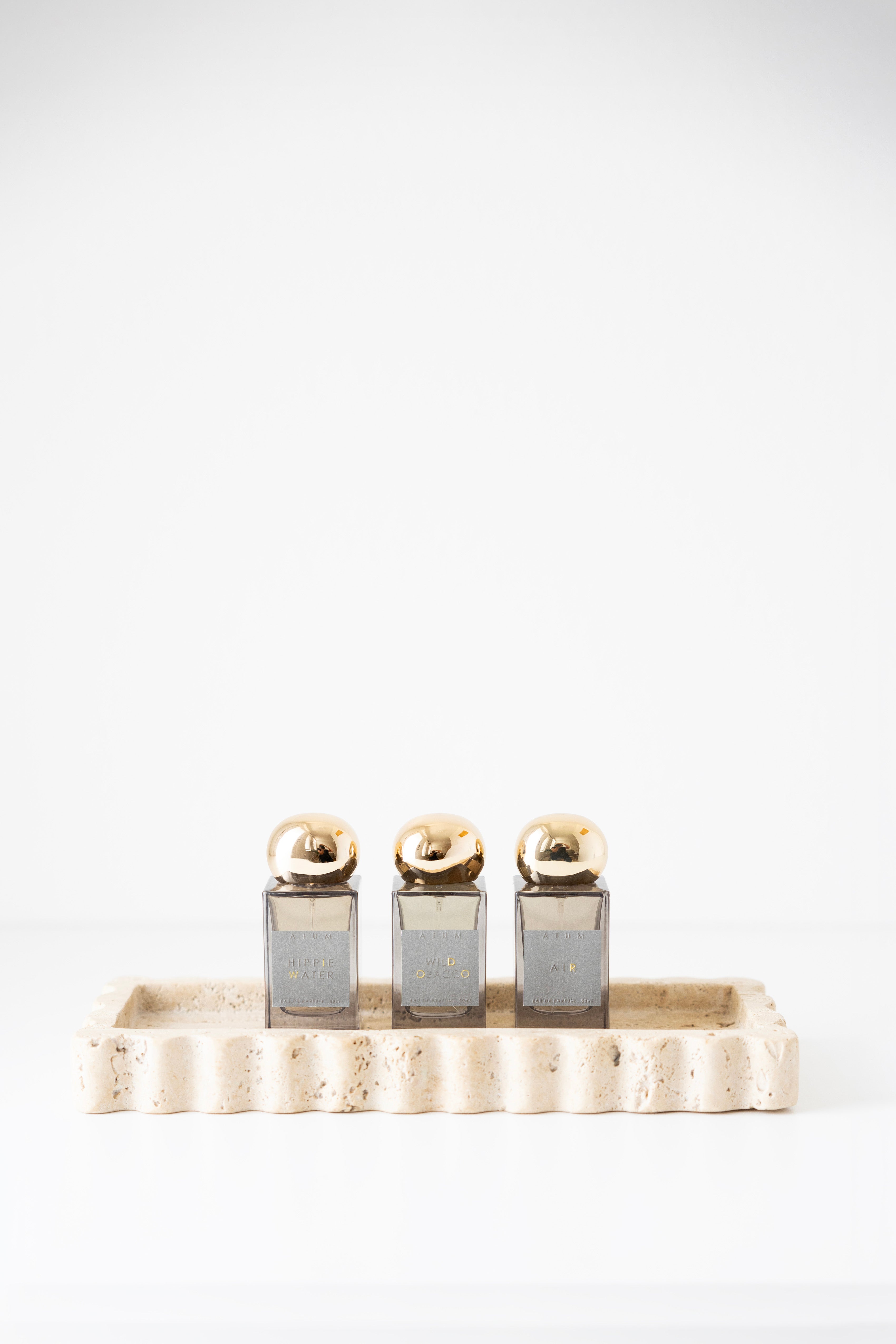 512 Tray - Travertine with perfume on it 