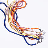 Set of colorful beaded lanyards on a white background