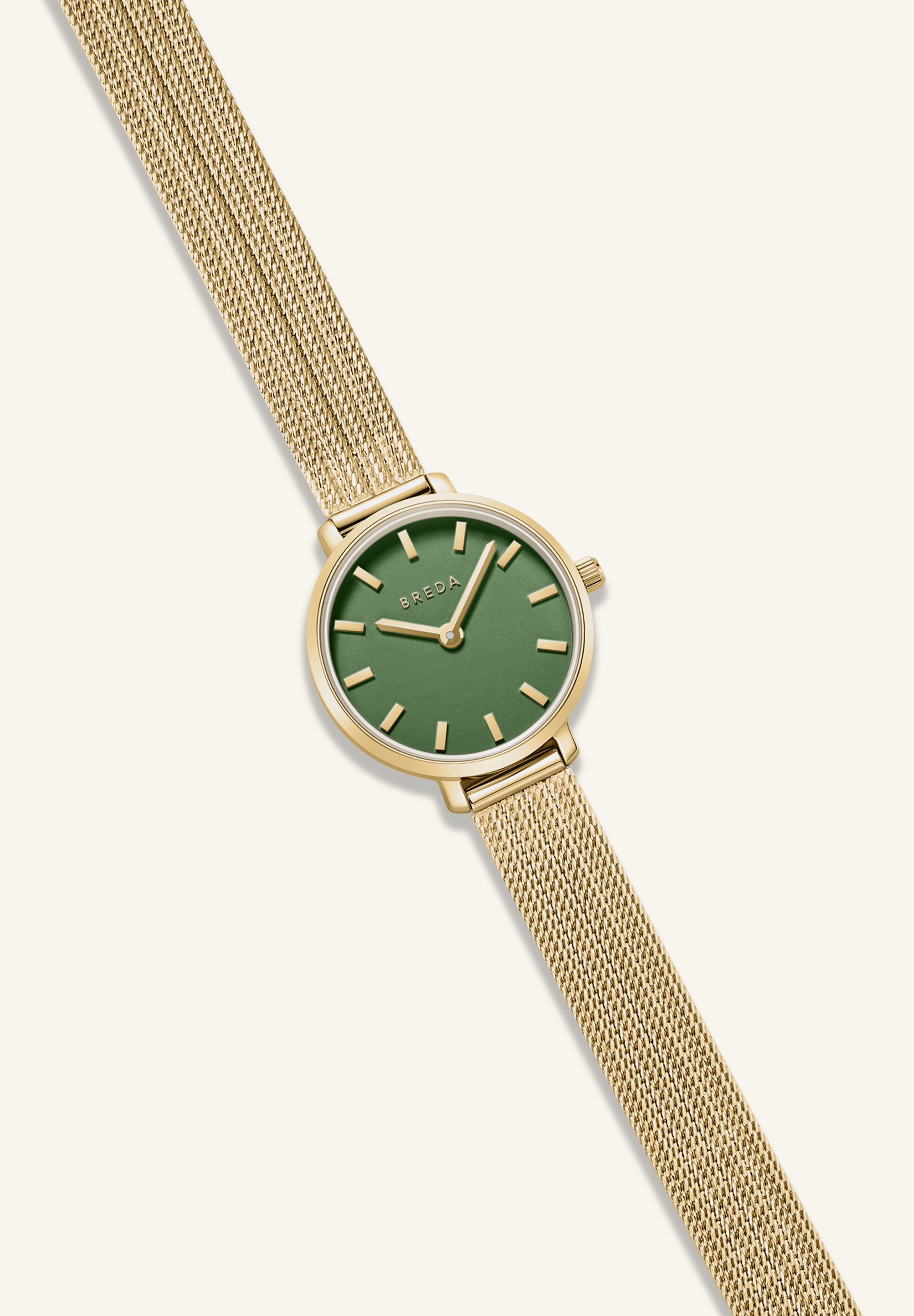 Gold watch with a green face on a white background