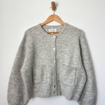 Amélie Alpaca Cardigan - Light Grey hanging on hanger
