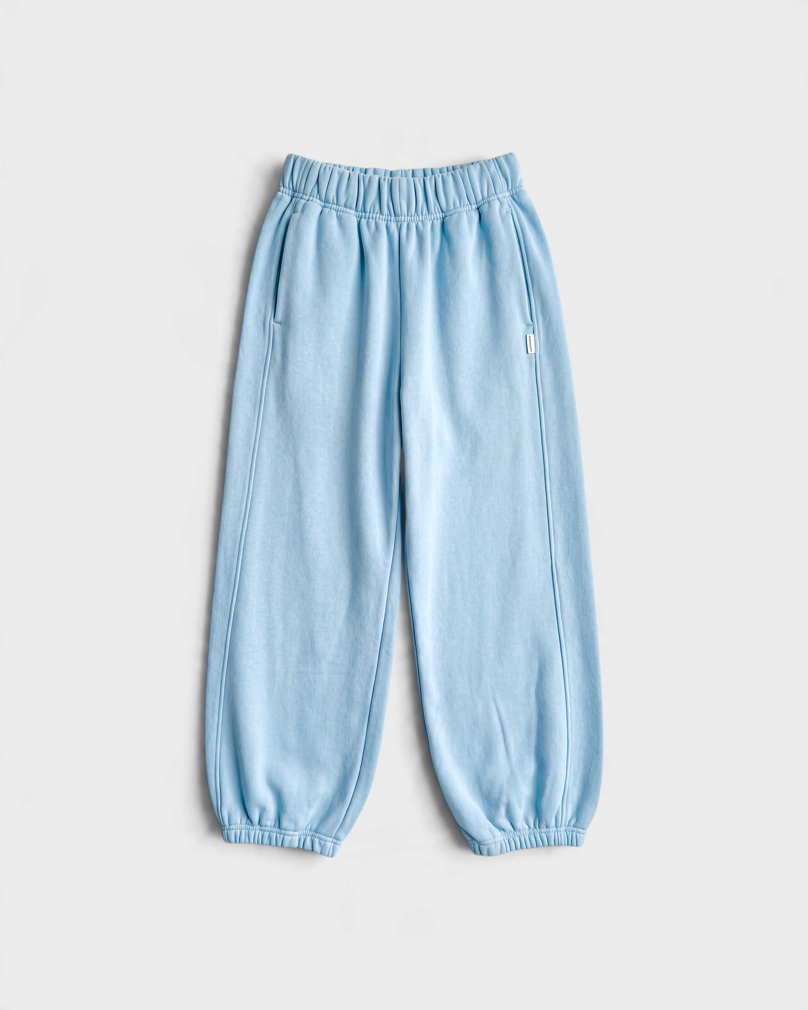 JONES + CO dream blue French terry balloon pants with high elastic waist, side panels, and elastic leg openings.