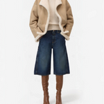 JONES + CO Wylie dark blue denim Bermuda shorts with carpenter details and silver studs, worn with boots.
