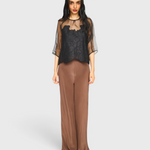 MIRTH Bari Organza Top in Black Waterlily — worn front view over cocoa silk trousers