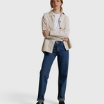 Model wearing a JONES + CO whitecap gray James button-up shirt over a white tee and blue jeans