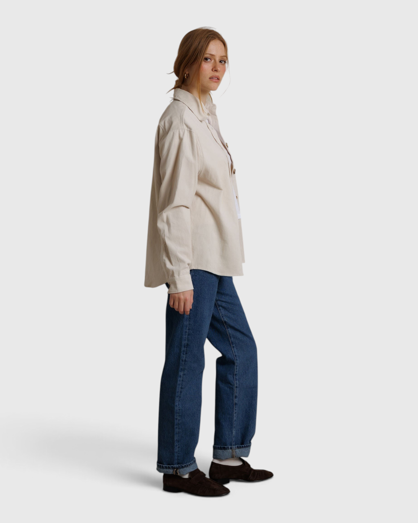 JONES + CO James button-up shirt in whitecap gray worn by a woman with blue jeans against a neutral backdrop