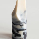 Marble-patterned soap on a light gray background