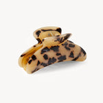 Tortoiseshell patterned hair clip on a white background