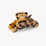 Tortoiseshell patterned hair clip on a white background