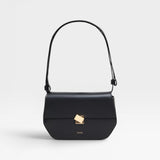 A black leather shoulder bag with a metal buckle, an adjustable strap, and the CLOSED logo embossed on the front.