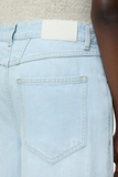 Back pocket and logo view of Lyna Jeans - Light Blue