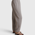 JONES + CO Dre sweatpants in cloud gray with an elastic waistband, shown from a side profile view.