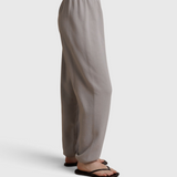 JONES + CO Dre sweatpants in cloud gray with an elastic waistband, shown from a side profile view.