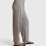 JONES + CO Dre sweatpants in cloud gray with a comfortable elastic waistband, shown from a side profile view.