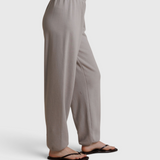 JONES + CO Dre sweatpants in cloud gray with a comfortable elastic waistband, shown from a side profile view.