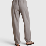 JONES + CO Dre sweatpants in cloud gray, featuring a comfortable elastic waistband and relaxed fit, back view.