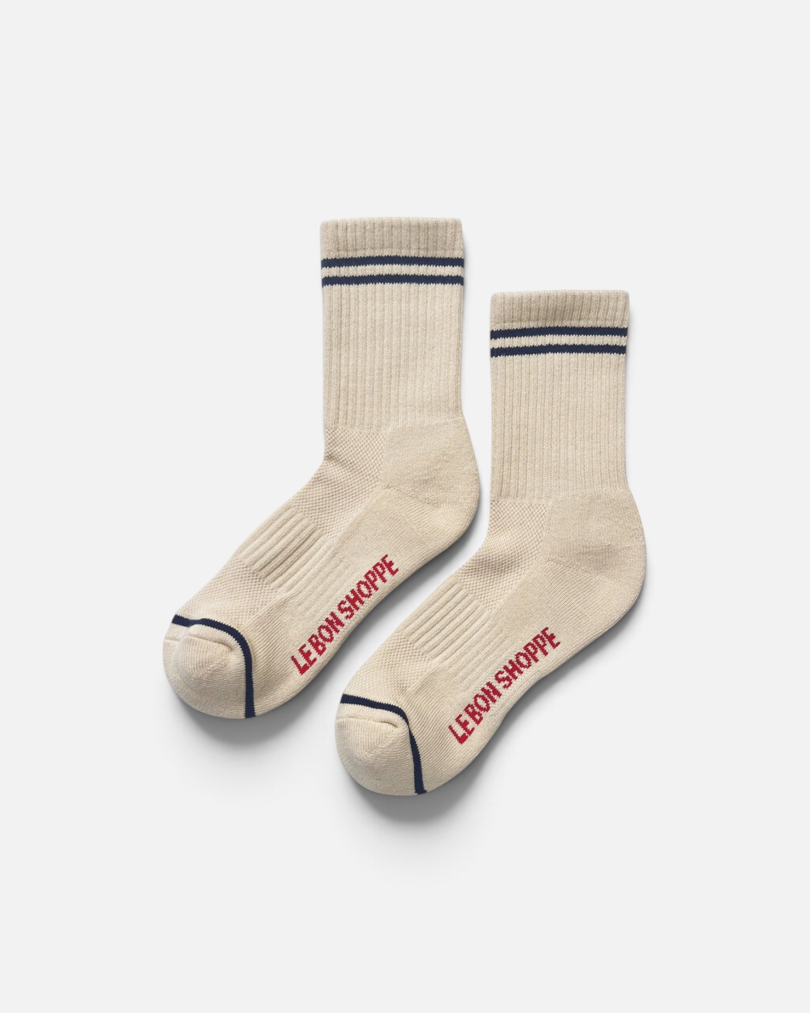 JONES + CO Boyfriend socks in cashew beige with navy blue stripes, breathable mesh top, and red logo branding.