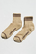 Pair of beige socks with brown stripes and 'Le Bon Shoppe' branding on a white background