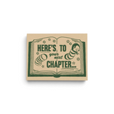 JONES + CO Next Chapter congratulations greeting card featuring a green book illustration on recycled kraft paper.