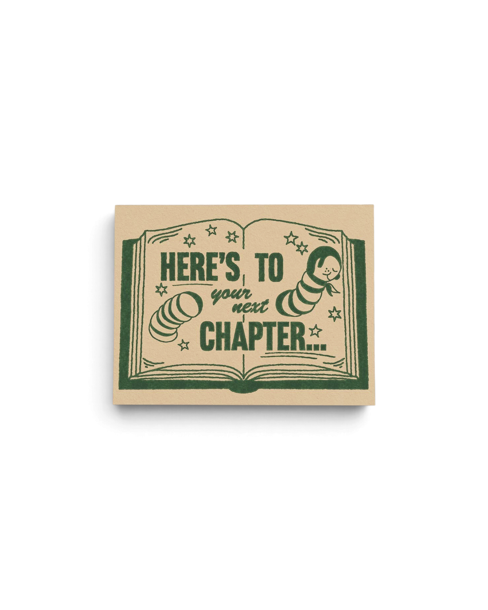 JONES + CO Next Chapter congratulations greeting card featuring a green book illustration on recycled kraft paper.