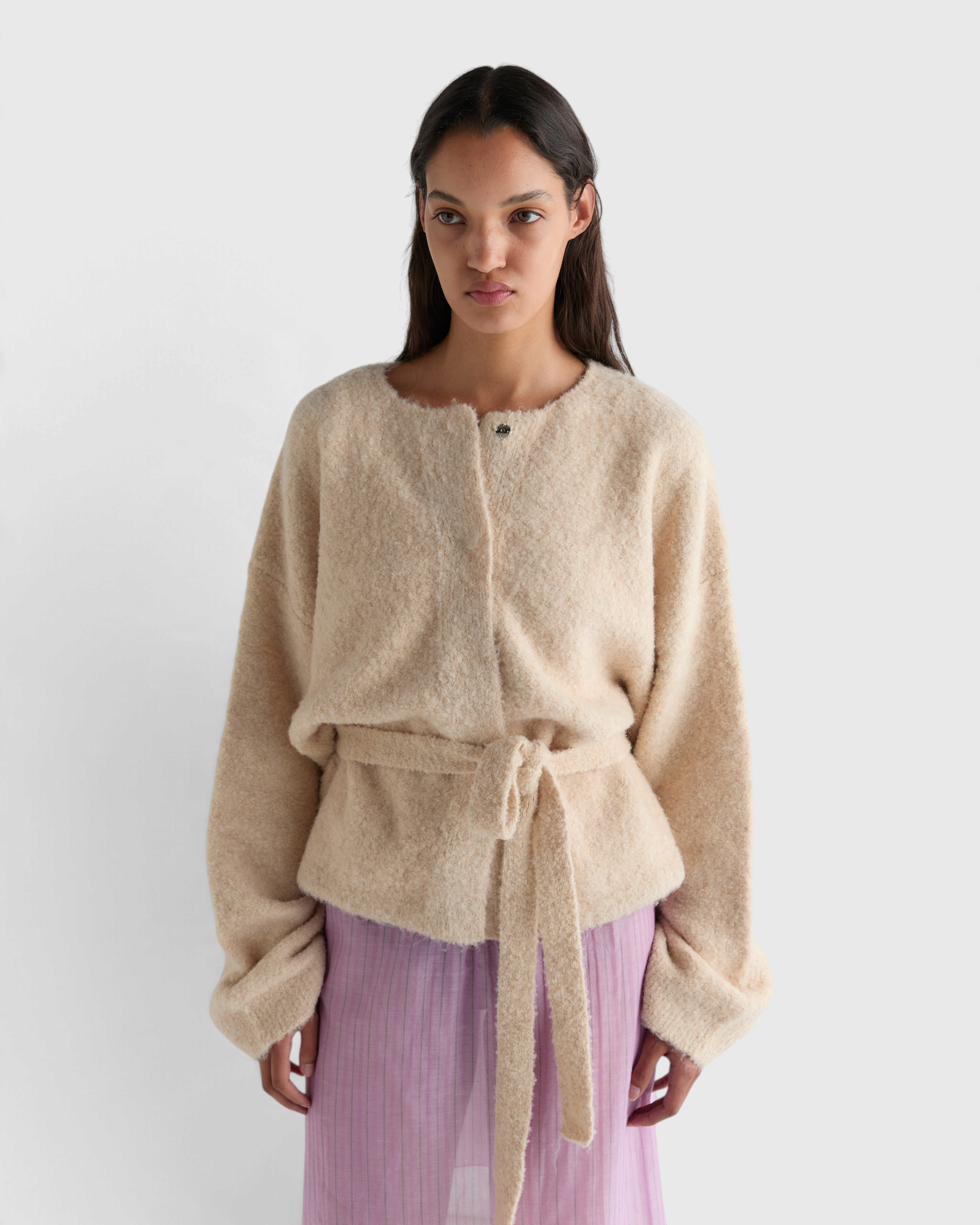 Deiji Studios Pod Knit in Oat — close front view, press-stud neckline and self-tie belt