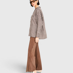 MIRTH Cardiff Silk Pant in Cocoa on model, side view showing the wide leg