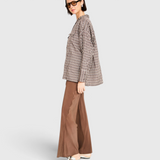 MIRTH Cardiff Silk Pant in Cocoa on model, side view showing the wide leg