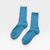 Her Socks in Blue Water
