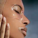 JONES + CO hydrating collagen gel mask on a model's face to soothe and refresh sun-damaged skin.