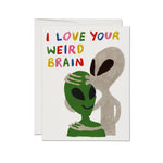 JONES + CO Alien Love Card featuring two aliens and the text I LOVE YOUR WEIRD BRAIN in colorful hand-drawn letters.
